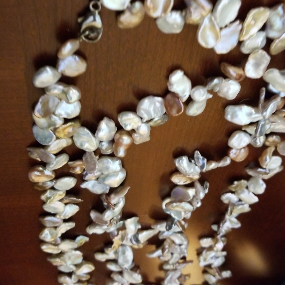 Two pieces  pearl shell necklaces.